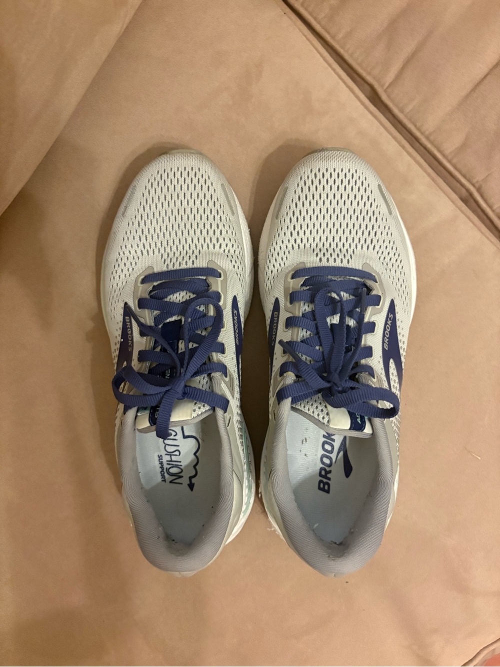 Brooks White Running Shoes with purple accents.